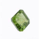 † A step cut peridot with canted corners