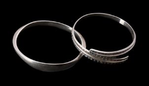 A silver coloured bangle by David Andersen