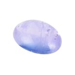 † An unmounted cabochon sapphire