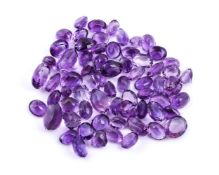† A packet of mixed cut amethysts