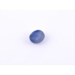 † An oval cabochon star sapphire