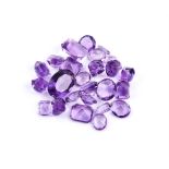 † A packet of mixed cut amethysts