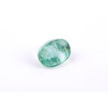 † An unmounted oval cut emerald