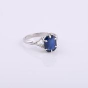 A synthetic sapphire single stone ring