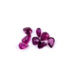 † A parcel of unmounted pear cut rubies