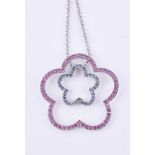 A blue and pink sapphire flower pendant