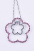 A blue and pink sapphire flower pendant