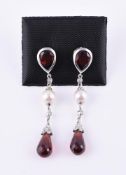 A pair of garnet, cultured pearl and diamond drop earrings
