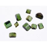 † A packet of step cut green tourmalines