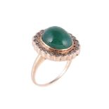 An emerald and diamond cluster dress ring