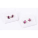 A pair of cabochon ruby and diamond point cluster earrings