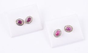 A pair of cabochon ruby and diamond point cluster earrings