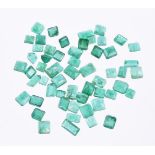 † A packet of step cut emeralds