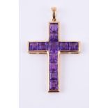 An amethyst set cross pendant