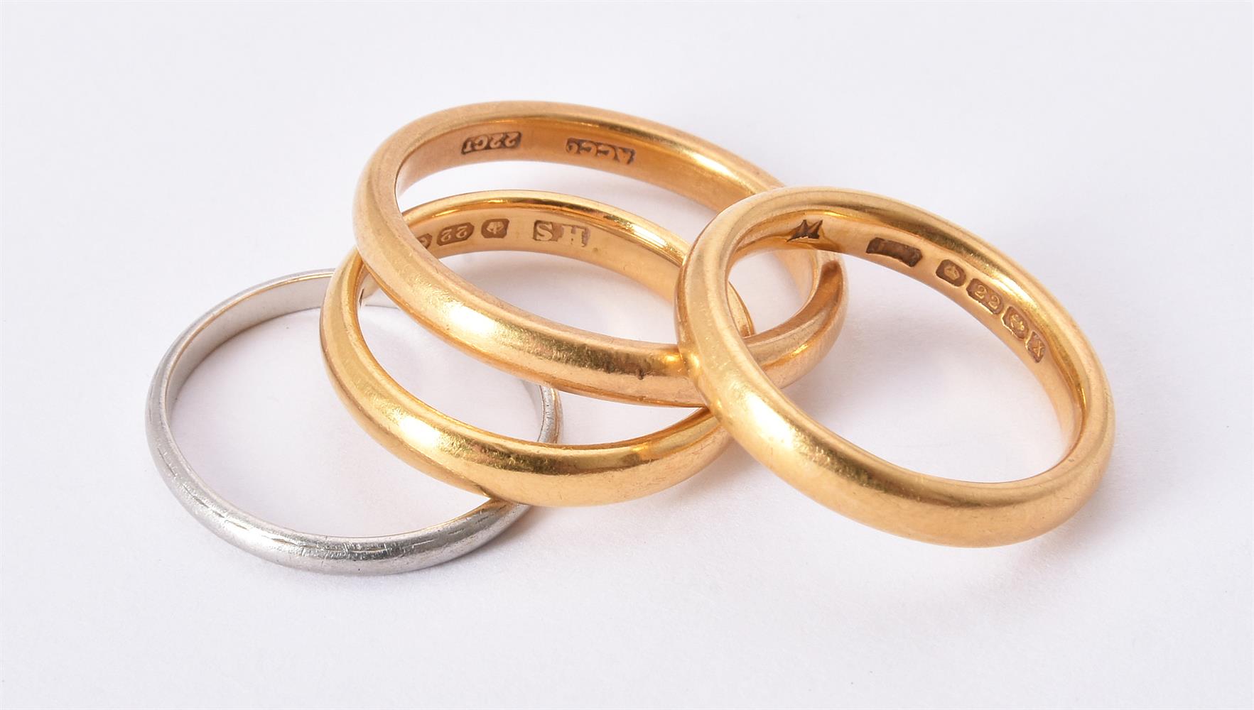 Two 22 carat gold band rings