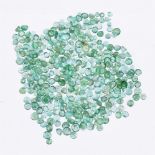 † A packet of circular cut emeralds