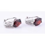 A pair of garnet and diamond ear clips