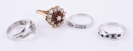 A 9 carat yellow gold opal and garnet cluster ring