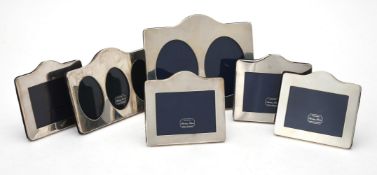 Six silver mounted shaped rectangular photo frames