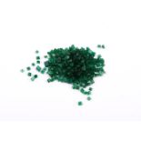 † A parcel of step cut emeralds