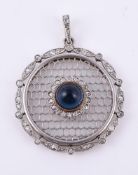 A diamond and synthetic sapphire pendant