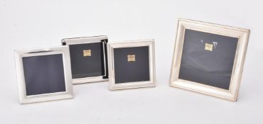 Four silver mounted square photo frames