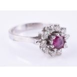 A pink sapphire and diamond cluster ring