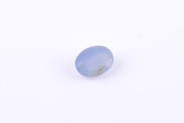 † An unmounted oval cabochon star sapphire
