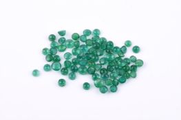 † A parcel of circular cabochon emeralds