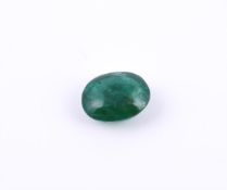 † An oval cabochon emerald