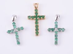Two emerald and diamond crosses