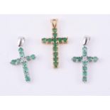 Two emerald and diamond crosses