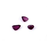 † Three vari cut unmounted rubies