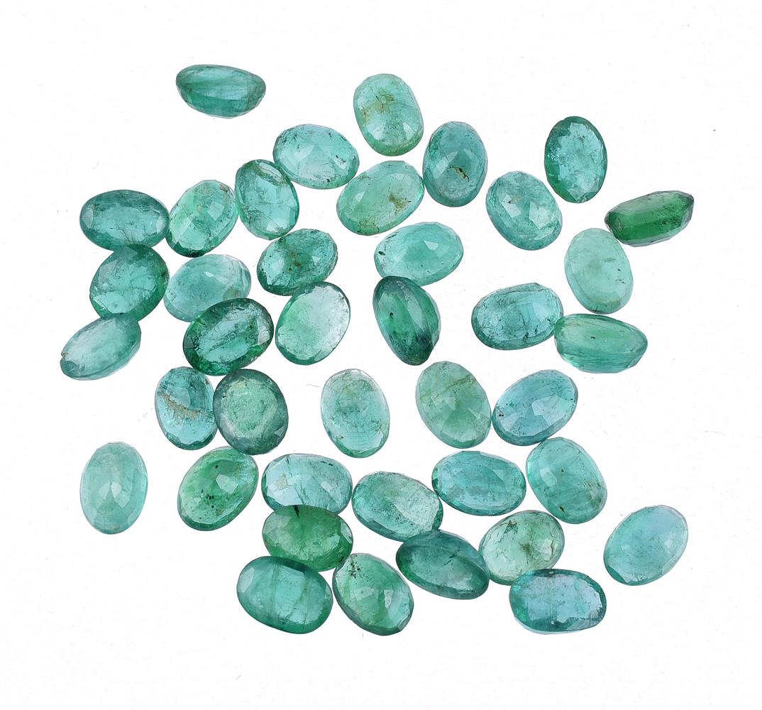 † A parcel of oval cut emeralds