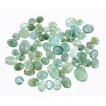 † A packet of unmounted oval cabochon emeralds