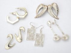 A collection of silver and silver coloured earrings