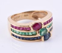 A ruby, sapphire and emerald triple row ring