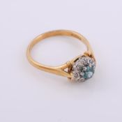 A blue zircon and diamond cluster ring