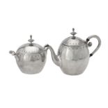 A Dutch silver circular bachelors tea pot and sugar bowl