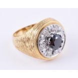 A diamond and black diamond cluster dress ring