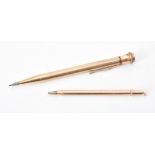 A gold coloured propelling pencil