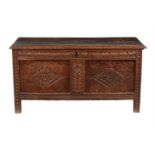 A carved oak coffer