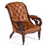 An early Victorian mahogany and buttoned leather upholstered library armchair
