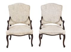 A pair of stained beech armchairs in Continental early 18th century style