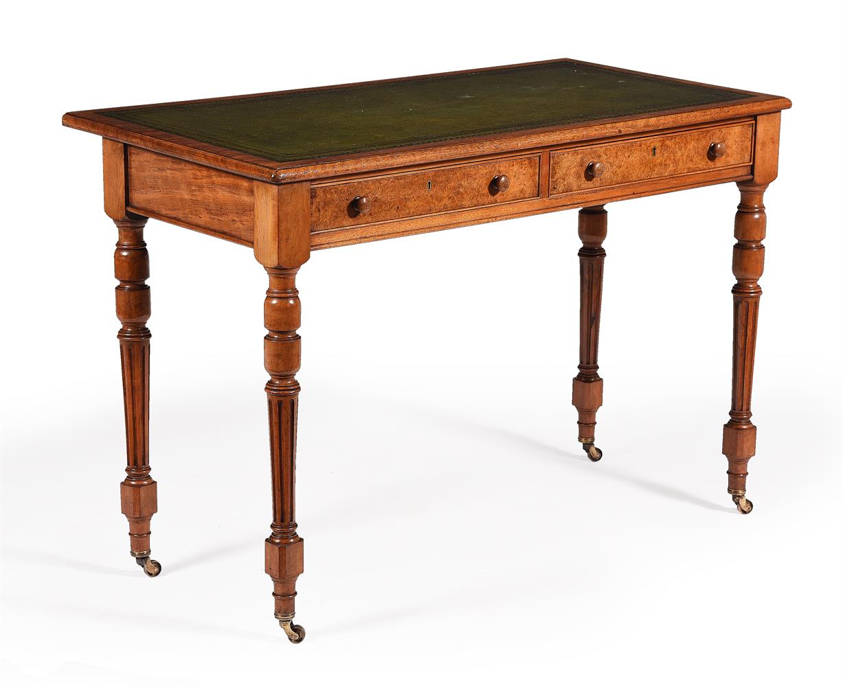 A Victorian walnut writing table
