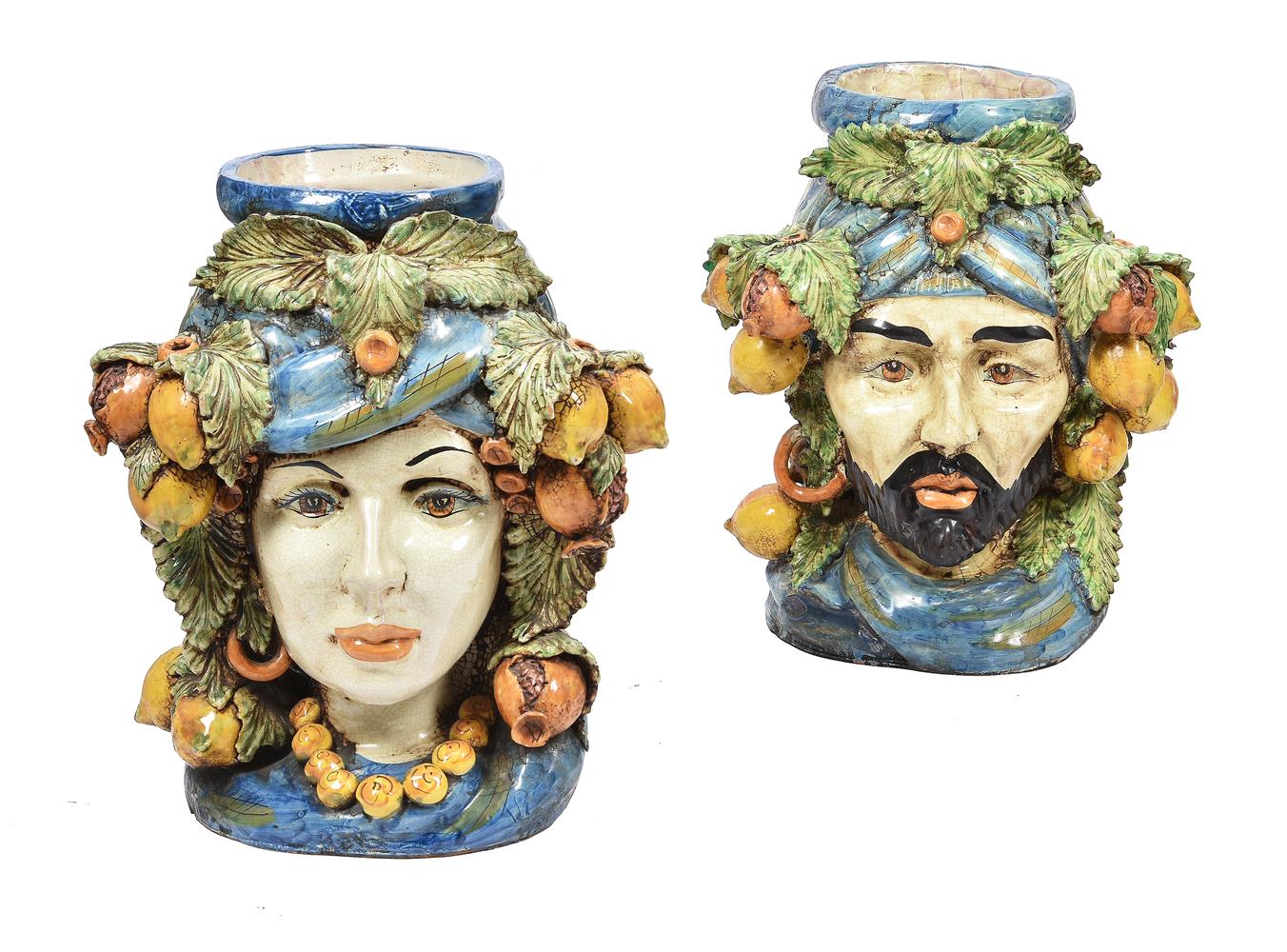 A pair of modern Sicilian Maiolica style figural head jars or planters