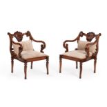 A pair of exotic hardwood open armchairs in Anglo-Indian early 19th century style