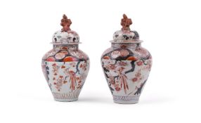 A pair of Japanese Arita vases and covers