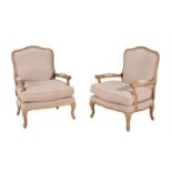 A pair of oak and upholstered armchairs in Louis XV style