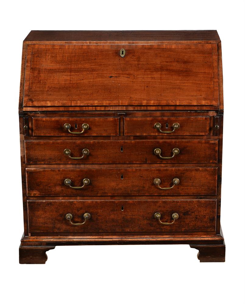 A George III mahogany and crossbanded bureau